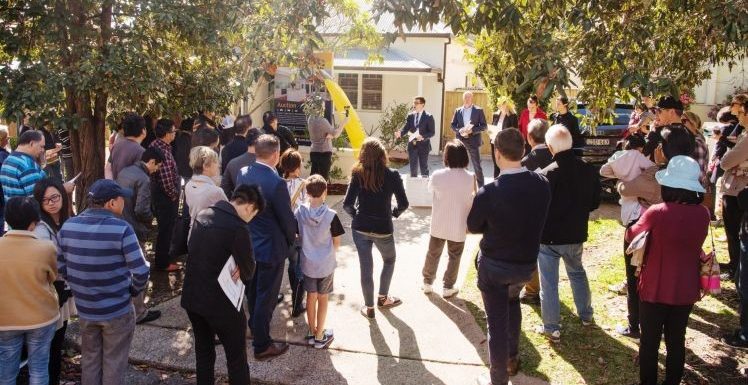 People Gather For Auction Day On A Sunny Weather
