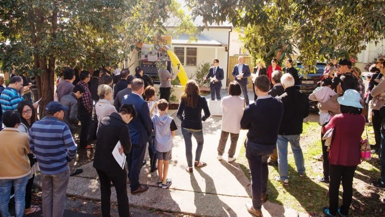 People Gather For Auction Day On A Sunny Weather